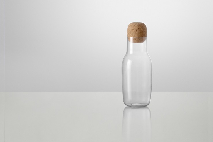 Same Same But Different: The idea behind Corky Carafe and additional drinking glasses was to work with a familiar and simple form with an oversized detail. The shape of the carafe is related to the archetype bottle - the bottle with a cork. The shape of the carafe has been given a functional character - that balances the characteristic of the ordinary. This might as well be a bottle of wine or milk bottle. The cap is large - it is easy to operate - and visible in use. The drinking glasses are meant for both wine and water - low key in their expression - for use both in everyday life and at a party.