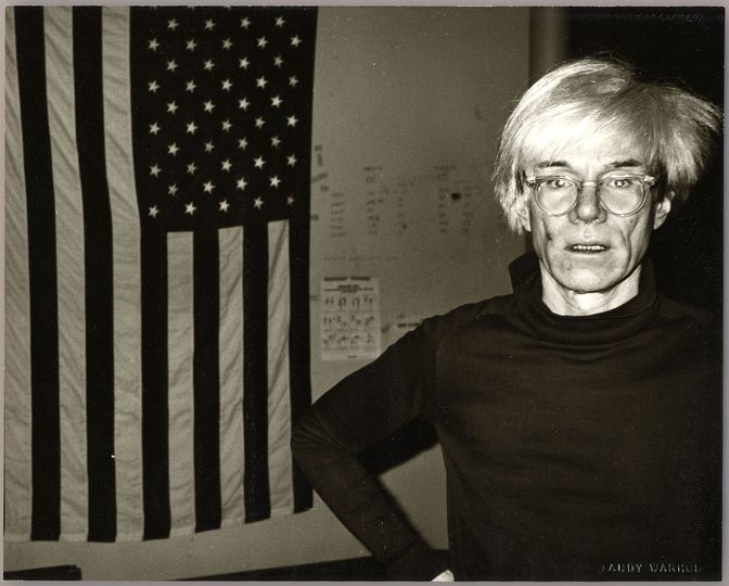 The Warhol & Basquiat Collaboration: Andy Warhol, Andy Warhol and American Flag, 1983. Courtesy Galerie Bruno Bischofberger, Schweiz. Photograph by Andy Warhol