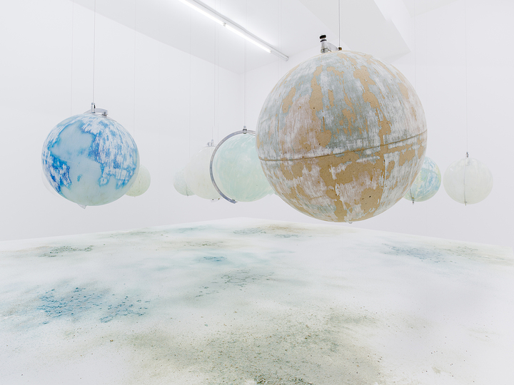 Kochi Biennale 2014: Julian Charriere's 'We Are All Astronauts' installed at Durbar Hall, Ernakulam. The artist has used thirteen found globes made of glass, plastic, paper and wood. Steel base with MDF board; dust from globes surface and international mineral sandpaper.
