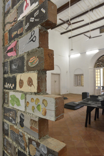 Kochi Biennale 2014: Unnikrishnan C's 'Untitled' work installed at CSI Bungalow, Fort Kochi. The artist has used oil and acrylic paint, carvings on terracotta bricks.