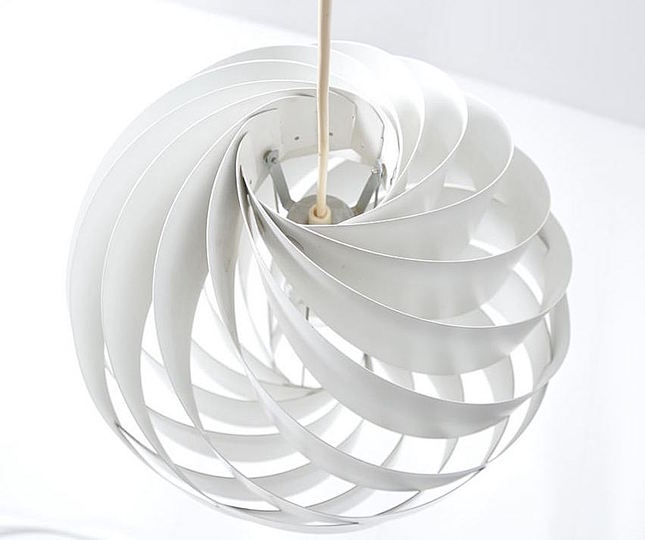 Louis Weisdorf: Multi-Lite and Turbo: Louis Weisdorf created the design for his Turbo pendant light in 1965, and in 1967 Lyfa was ready to start production. Consisting of 12 uniform aluminium lamellae spiral-twisted to form a flower-like sphere, the Turbo was partly inspired by Japanese rice-paper lanterns, and came in two sizes – the 35cm diameter Turbo I (available in orange, red, beige or white) and the 60cm Turbo II (in white only).


The Turbo was winning an iF (Die gute Industrieform) product design award in 1973, and remained in production well into the 1970s. 

In 1991  a new version of the Turbo was put into production by Lyskjær-Lyfa, without the knowledge or approval of Louis Weisdorf. Renamed Regina and made of steel, the lamp was so heavy it had to be suspended by a wire. Weisdorf took the company to court and sales were halted.

In 2004 the Turbo was reissued again in white versions.