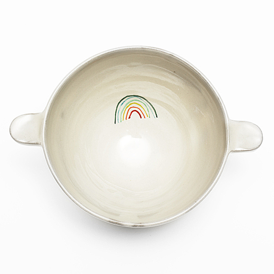 Serve Up!: Two-handle bowl. Emblematic item of our childhood, the two-handle bowl evokes a delicious hot chocolate. Francine Triboulet revisits this traditional classic and revives it with a rainbow decoration. A mouth-watering collection for everyone to enjoy. Designer : Francine Triboulet. Stand name : FRANCINE TRIBOULET. Show : MAISON&OBJET Copyright : Anthony Girardi