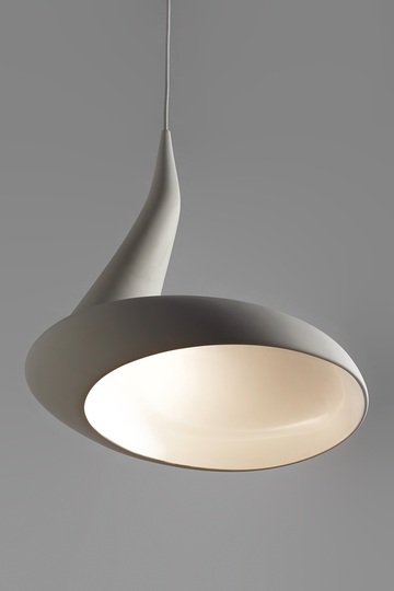 Ash Allen: Inspired by a dollop of cream falling gently off a spoon, I wanted to create a sensual, organic pendant light full of contrasts.

Asymmetric but perfectly balanced, matt on the outside, glossy on the inside, narrow at the top and voluminous at the bottom.

A 7W warm white LED globe hidden from sight, indirectly illuminates the large space below.

Made from an earthenware ceramic slip casting, two lights work well together as a pair. 


Winner of the 2013 