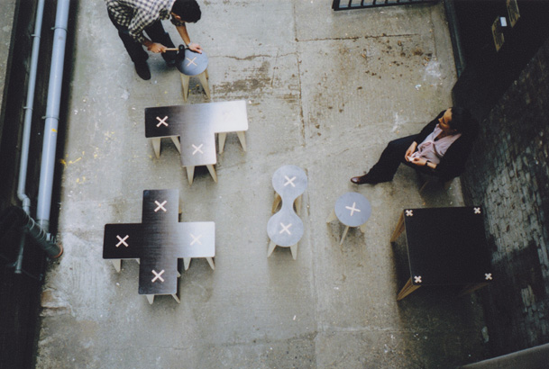 X marks the spot: A collaborative project with multidisciplinary practice DPQ to develop a family of furniture for the Dazed & Confused Live festival at the Tramshed. 

X marks the spot is a collection of furniture encompassing tables, benches and love seats, all of which can be put together without any fixings. The criteria for the design was borne from the brief ‘to create 100 seats under £10 each in 10 days’. Rather than create temporary seating, we were keen to look at ways to manufacture a cost effective seat, which would be quick to assemble but long lasting.

The cross in the centre of each piece is not just decorative, but expresses how the piece was assembled and marks the spot to sit.