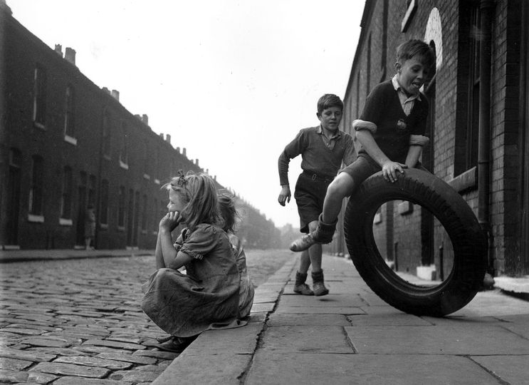 Iconic Photos from the Getty Images gallery: Salford Street Fun

1951: Children playing with an old tyre on the streets of Salford, Manchester. Original Publication: Picture Post - 5461 - Salford Holiday - unpub. (Photo by John Chillingworth/Picture Post/Getty Images)

John Chillingworth