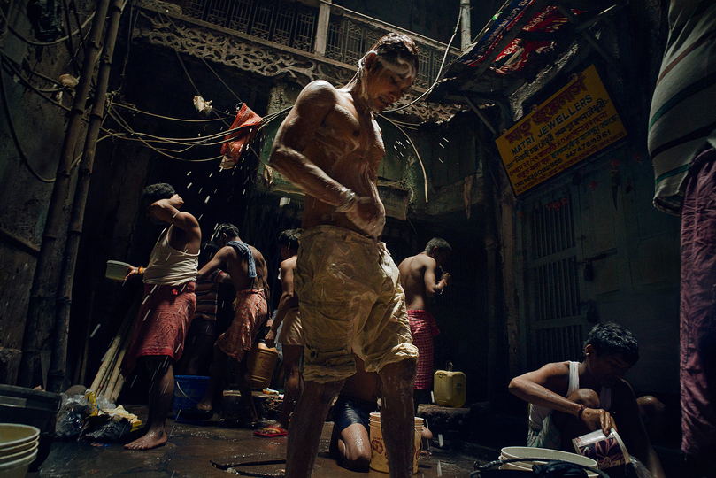 Sony World Photography Awards: A young man baths in one of the abandoned shophouses in Old Kolkata, getting ready for the day. Abandoned shophouses like this are sometimes converted to a public bath house by the local migrants, who do not have a home of their own..

Nick Ng Yeow Kee

© Nick Ng Yeow Kee, Malaysia, 1st Place, Low Light, Open Competition, 2015 Sony World Photography Awards.