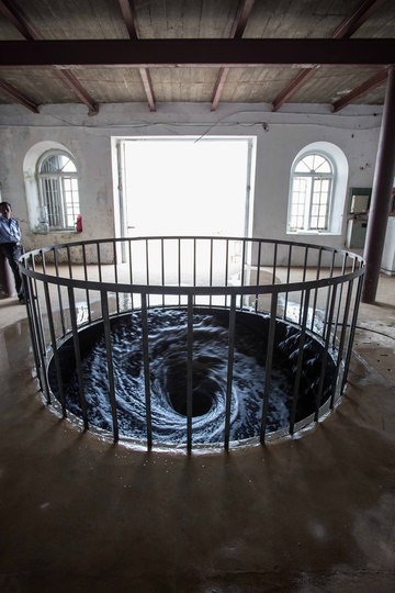 Kochi Biennale 2014: Anish Kapoor's water vortex 'Descension' is installed at Apsinwall House, Fort Kochi. 
