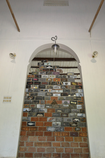 Kochi Biennale 2014: Unnikrishnan C's 'Untitled' work installed at CSI Bungalow, Fort Kochi. The artist has used oil and acrylic paint, carvings on terracotta bricks.