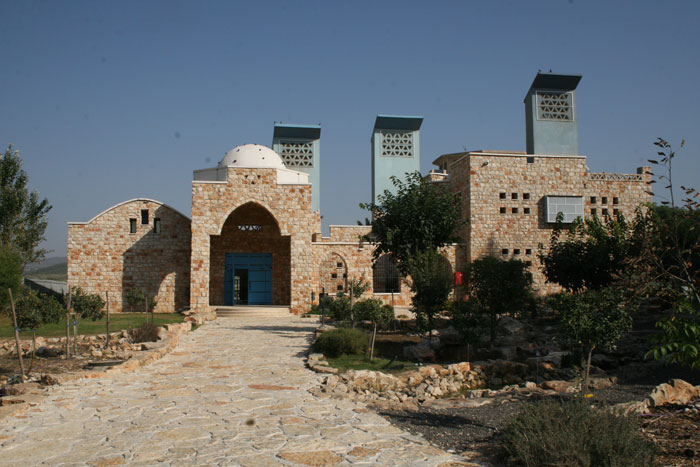 SEED Awards: The Towns Association for Environmental Quality (TAEQ) Green Building, located in Sakhnin, is home to the first environmental organization to arise out of Israel’s minority Arab sector, which comprises 20% of the total population of the country. TAEQ is a municipal collaborative that organizes funds and resources from the six participating Arab municipalities for social, environmental, and economic development. Located in Israel’s northern Galilee region, TAEQ serves the populations of these towns, about 80,000 residents. Acting as a cultural meeting ground, the green building hosts 60,000 visitors to its campus annually, including women, farmers, the elderly, school groups, teachers, university students, scientific researchers, city planners, employees of local municipalities and visitors from abroad. Visitors participate in workshops and training courses related to ecology and sustainable development.