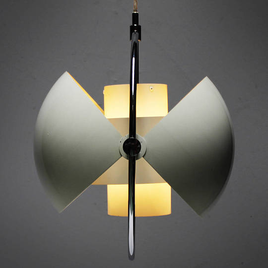 Louis Weisdorf: Multi-Lite and Turbo: 

Among Louis Weisdorf’s 1970s lamp designs, the Multi-Lite is one of the few to be taken into production. The core of the Multi-Lite is a two-cylinder form that would work as a shade on its own but is additionally encompassed by a large metal ring anchoring two quarter-spherical shells. The shells can be individually rotated to create multiple arrangement combinations. 

Weisdorf made the drawings for the Multi-Lite in 1972 and Lyfa produced it from 1974. It came out in two colours – one in white with a chrome ring, and the other in matt-finished brass with a white interior.

