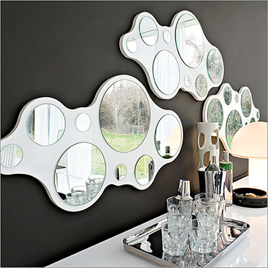 New furniture: Enrico Zanolla:
Bubbles is a very versatile mirror. It can be used in different combinations on the wall, using two or three items together. Made of a wood panel with different diameter mirrors glued on it.

