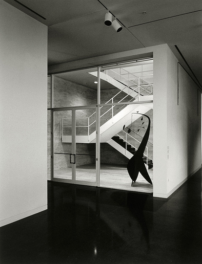 The Production Line of Happiness: Christopher Williams (American, born 1956). Main Staircase for the Arts Club Chicago, 1948–51 / Steel, travertine marble / 359.4 × 458.8 × 609.3 cm / (141 1/2 × 180 5/8 × 239 7/8″) / Arts Club commission 1948–1951 / Ludwig Mies van der Rohe / 109 East Ontario Street, / Chicago, Illinois, 1951–1995 / Repositioned by John Vinci / 210 East Ontario Street, / Chicago, Illinois / October 1, 1998. 1998. Gelatin silver print. Paper: 14 x 11″ (35.6 x 28 cm); framed: 26 x 30″ (66 x 76.2 cm). The Art Institute of Chicago, Jacob and Bessie Levy Art Encouragement Fund, 2004.18 © Christopher Williams