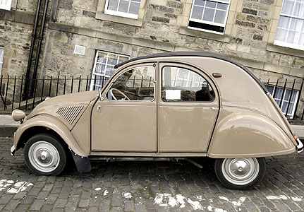 Everyday Design Classics of the 20th Century: The iconic Citroën 2CV, parked in a Parisian steet. 