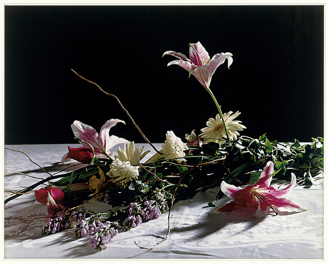 The Production Line of Happiness: Christopher Williams (American, born 1956). Bouquet for Bas Jan Ader and Christopher D’Arcangelo. 1991. Archival corrugated board, archival photo corners, compound, 4-ply Conservamat, 8-ply Conservamat, drywall, dye transfer print, glass, lacquer-based finish, linen tape, nails, Northern maple, plastic setback strips, primer, screws, seaming tape, paint, and wood. Overall: 120 x 180 x 6 3/4″ (304.8 x 457.2 x 17.1 cm). Lorrin and Deane Wong Family Trust, Los Angeles © Christopher Williams