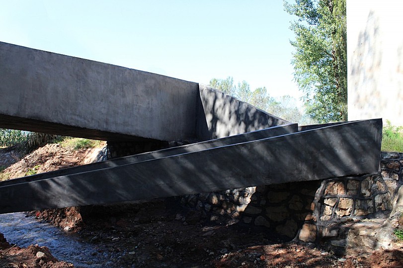 A Bridge: This produces a wide, direct path for small trucks and motorcycles and a pedestrian path that cuts under the bridge to allow direct access to the river for washing, cleaning or fishing. 