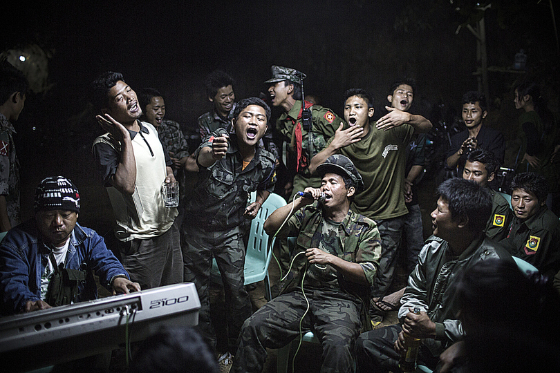 World Press Photo 2014: © Julius Schrank, Deutschland, for De Volksfront. In the city of Laiza, Kachin State of Burma, the Independent Armny (KIA) soldiers are drinking and singing at  the funeral of their commander. Kachin rebellion is only one of the many ethnic clashes in Burma, where military junta has been ruling the country for the past 40 years.