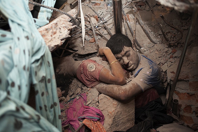 World Press Photo 2014: World Press Photo 14 3rd prize winner © Taslima Akhter, Bangladesh. On the day the Rana Plaza building collapsed in Sabhar, Bangladesh, still unknown number of people who were inside this textile factory fell victim. The nature of the relationship between these two people in this photo is not known. Some 800 corpses were found in this tragic site, making this tragedy the largest industrial accident in history.