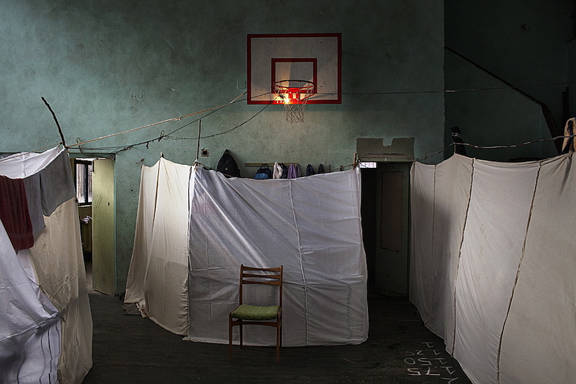 World Press Photo 2014: © Alessandro Penso, Italy, OnOff Picture. This photo by Alessandro Penso won the first prize in the Reportage Photo category. People who fled from the conflict in Syria have built a temporary domicile in a school sport hall in Sofia, Bulgaria. The number of Syrian refugees seeking asylum at the Turkish border onward to Bulgaria has drastically increased in 2013. At least 8,000 people come from Syria and Afghanistan. Bulgaria however is one of the poorest countries in the European Union and cannot quite cope with the influx of the situation. The country is struggling to provide necessary water, heating facilities, food, and medical services. Currently, there are about 2.4 million Syrian refugees waiting for asylum but only 18,000 places are available.