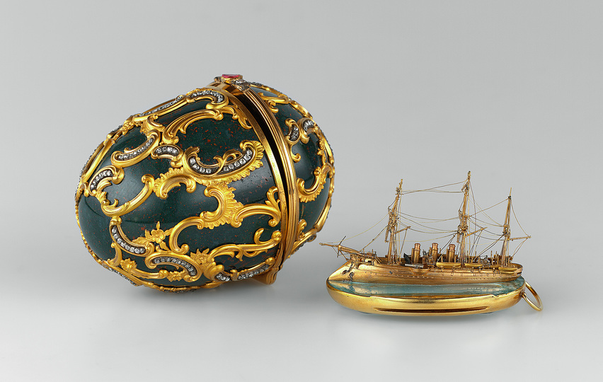 The World of Fabergé: The house of Fabergé is best known for the Imperial Easter eggs that Peter Carl Fabergé and his workmasters created for the Russian Imperial family – one of the reasons why he was known as the “Cellini of the North”. Egg with model of the cruiser “Memory of Azov” Presented by Emperor Alexander III to his wife, Maria Feodorovna at Easter 1891 Saint Petersburg, 1891 House of C. Fabergé, Artist: M. Perkhin. Heliotrope, aquamarine, brilliants, rose-cut diamonds, gold, ruby, platinum, silver, velvet egg: 9,3 х 7 cm, model: h. 4 cm, l.7 cm © The Moscow Kremlin State Historical and Cultural Museum and Heritage Site.