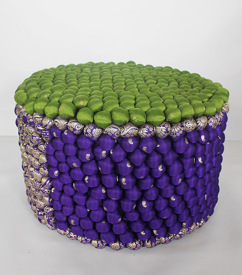 Upcycled: Studio Avni, Pompom Pouf, 2013, Shell: Upcycled silk saris, Polyfill, Filler: foam, H 33, Ø 50 cm, © Avni Sejpal
