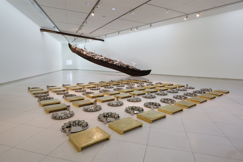 Subodh Gupta - Everything is Inside: Subodh Gupta, School (2008) [bottom installation] and All in the Same Boat (2012 - 2013)[hanging. Installation view (detail) MMK Museum für Moderne Kunst Frankfurt am Main. Photo: Axel Schneider © MMK Frankfurt