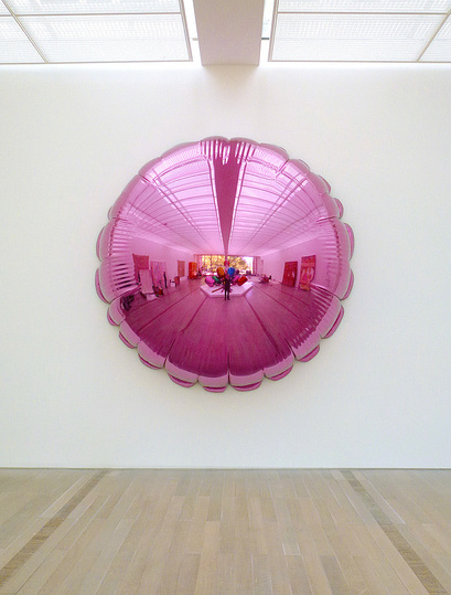 Jeff Koons at the Whitney: Moon (Light Pink), 1995-2000, mirror-polished stainless steel with transparent color coating, 315 x 315 x 101.6 cm. One of five unique version. Collection of the artist.