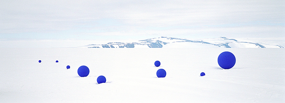 A short history of bubbles: Polar researcher and photographer Jean de Pomereu places blue bubbles in the expansive white snowscapes of Antarctica to create fascinating images with a Sci-Fi touch.